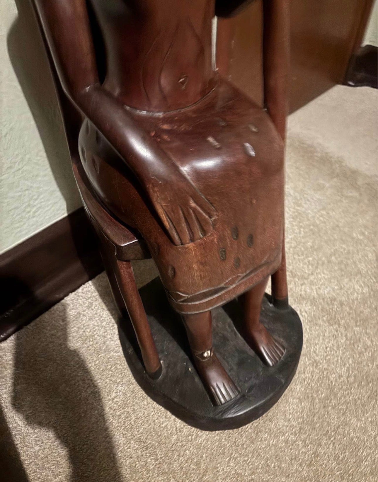 African Hand-Carved Seated Figure with Staff