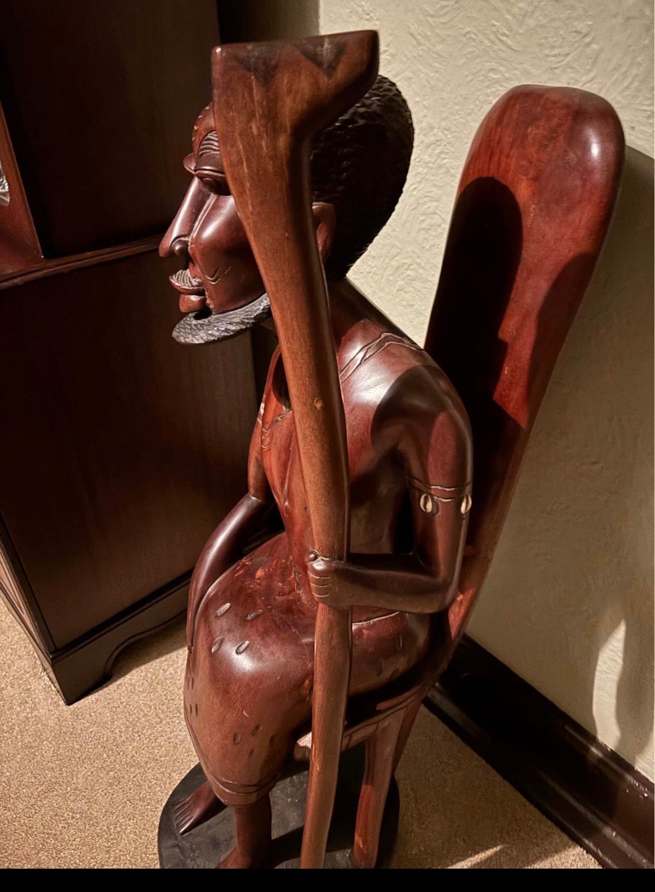 African Hand-Carved Seated Figure with Staff